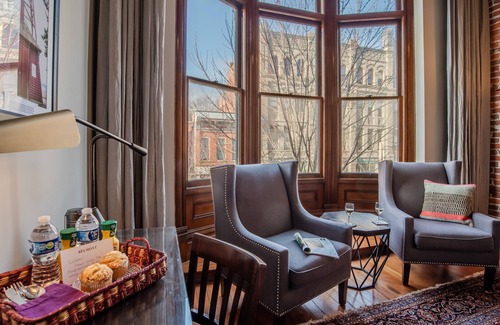 Adelma Beach Apartment | Historic Town View Room with bay window overlooking Water Street