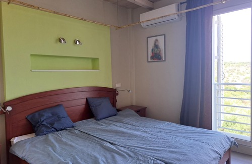 Pylos-Nestoras Apartment | Holiday flat with a beautiful view over the sea to Koroni on the Peloponnese.