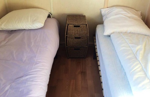 Grandcamp-Maisy Ski Chalet | Homerez - Chalet for 4 ppl. with shared pool and garden at Grandcamp-Maisy