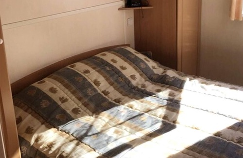 Grandcamp-Maisy Ski Chalet | Homerez - Chalet for 4 ppl. with shared pool and garden at Grandcamp-Maisy