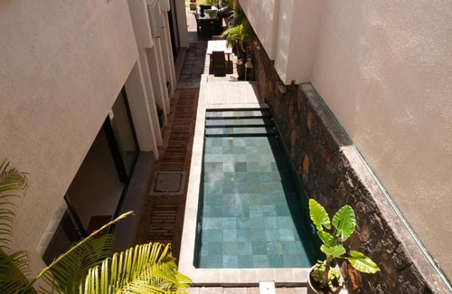 Pointe aux Canonniers Villa | Homerez - Villa for 8 ppl. with shared pool at Pointe aux Cannoniers, Grand Baie