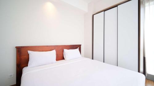 Surabaya Apartment | Homey 3BR with Private Lift at Grand Sungkono Lagoon Apartment By Travelio