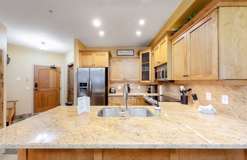 Big White Ski Resort Condo | Homey ski-in/out condo with private hot tub & entertainment