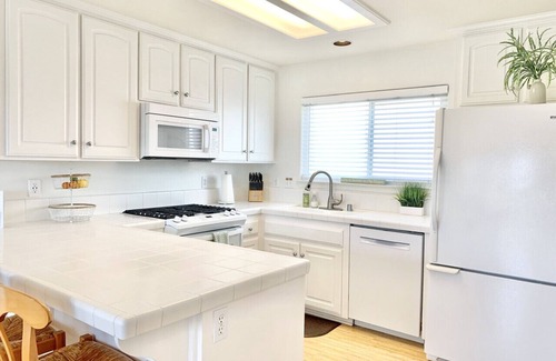Downtown Condo | Host By Owner! Family Size Condo! Walk to the Beach & Downtown! Two-car garage!