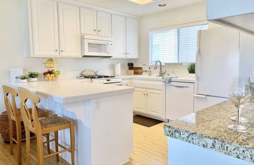 Downtown Condo | Host By Owner! Family Size Condo! Walk to the Beach & Downtown! Two-car garage!