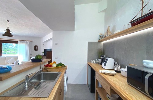 La Maddalena Apartment | House on the beach of Monti d'à Rena with terrace, garden and wi-fi connection