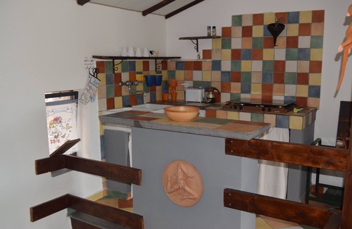 Santa Venerina Cottage | House surrounded by greenery surrounded by olive trees lemons oranges and chestnut trees