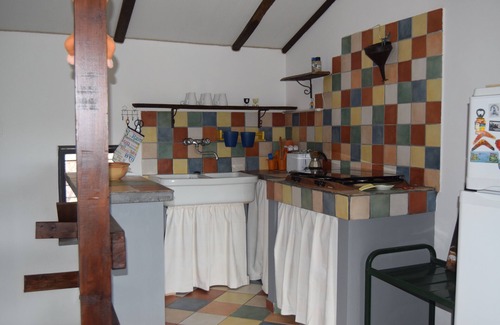 Santa Venerina Cottage | House surrounded by greenery surrounded by olive trees lemons oranges and chestnut trees