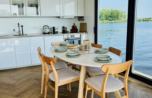 Kaag Boat Rental | Houseboat "Nevel" at the Kagerplassen tender included