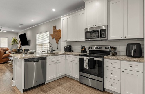 College Station House | Howdy Hideaway! Texas-Sized Fun at A&M: Arcade, Slide, Fire Pit, 85" TV & More!