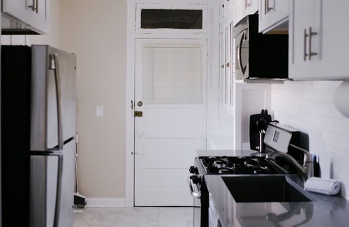 Irving Park East Apartment | Huge Projector and Designated Workspace - Near Wrigley!