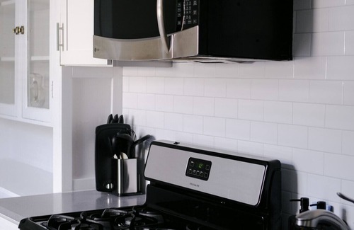 Irving Park East Apartment | Huge Projector and Designated Workspace - Near Wrigley!
