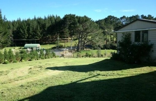 Kellys Bay House | Idyllic Pouto Peninsula. distant Water farm Views