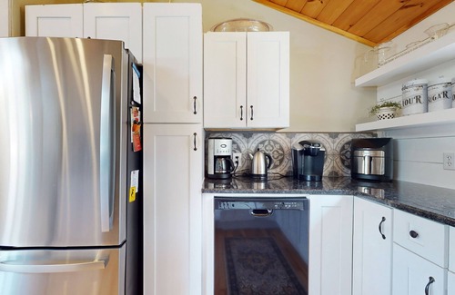 Manchester House | Idyllic & sunny lakefront home with large patio & views - near golf & skiing