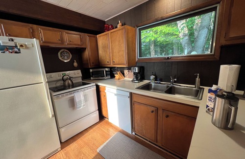 Kewadin House | Imogene's- Torch Lake cottage, waterfront w/dock