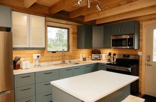 Malagash Mine House | Indulge in Serenity at The Golden Pearl: A Beautiful Log Cottage Escape