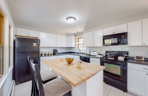 Sandwich House | Inviting abode near the canal with a wood-burning fireplace, grill, & W/D