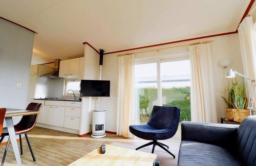 Hollum Ski Chalet | Inviting Dune Chalet in Hollum between Golf course and Beach