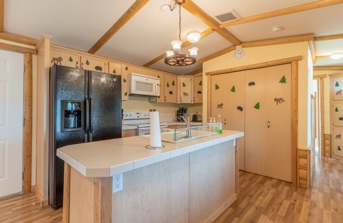Polson House | Inviting lake view home with fireplace, golf nearby, full kitchen, & W/D