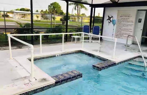 Flamingo Bay House | ISLAND TIME! DOCK! POOL! KAYAKS! BOAT To BEACH! PETS ALLOWED! The Purple House