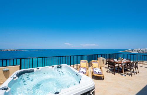 Bugibba Apartment | Islet Promenade Seafront Penthouse with breathtaking seaviews and private hot tub on the large terrace by Getawaysmalta