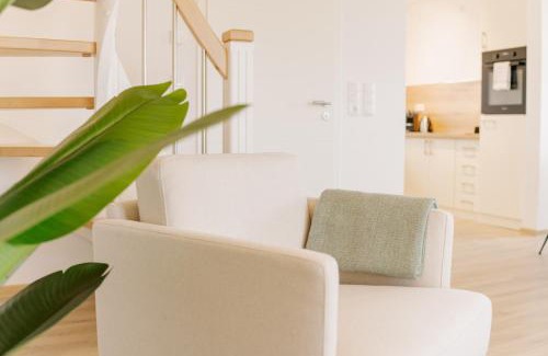 Greetsiel Apartment | Küsten Suite Grachten Suite 1 direkte Wasserlage, Terrasse, 76qm, Neubaugebiet