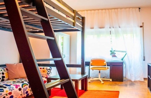Quartiere XVII Trieste Apartment | KAMCHŪ APARTMENTS VILLA CHIGI: PRIVATE DOUBLE BEDROOM, LOUNGE AREA with SOFA #L2