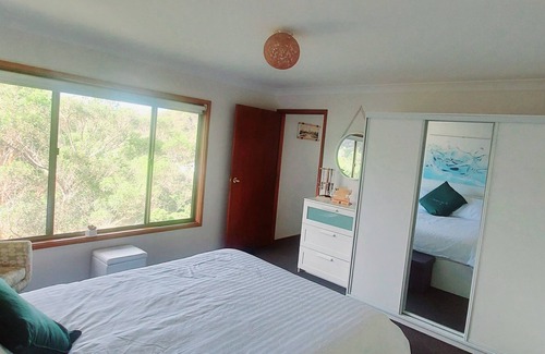 Horsfield Bay House | Kick back and relax in a treehouse with Bay views