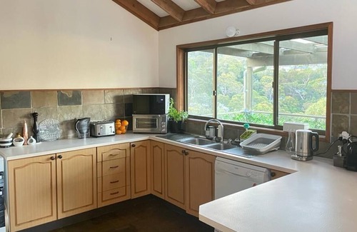 Horsfield Bay House | Kick back and relax in a treehouse with Bay views