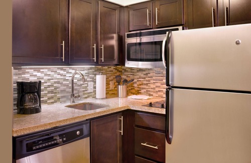 Midvale Apartment | King Suite | Heated Pool & Hot Tub. Free Breakfast Buffet. Near Jordan Landing!