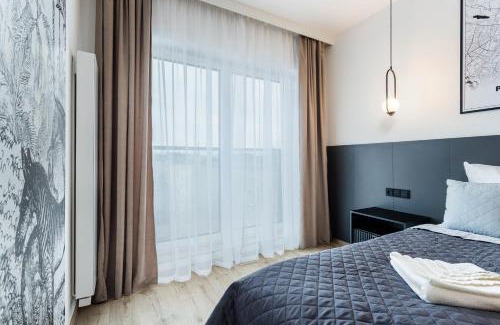 Jezyce Apartment | Klimatyzowany Apartament Very Berry z Parkingiem w Poznaniu by Noclegi Renters