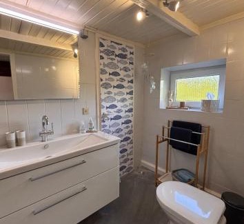Norden House | Lüttje Koje - Ferienhaus direkt am Deich und dem Meer dahinter