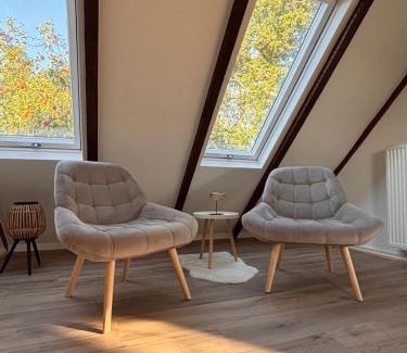 Norden House | Lüttje Koje - Ferienhaus direkt am Deich und dem Meer dahinter