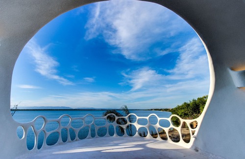 Cocoplum Apartment | Lagoon-front studio with water access, infinity pool, & AC