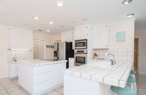Silver Sands House | Lagoon Hideaway | Waterfront 4BR Home, Pool, Dock, Game Room, Short Walk to Beac