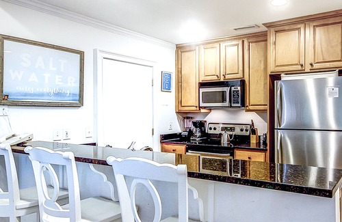 Isle of Palms Villa | Lagoon view condo w/ private balconies, shared pool & basketball - beach access
