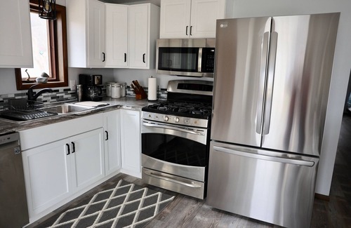 Arnolds Park House | Lake front, HUGE yard and deck, walking distance to the heart of Okoboji