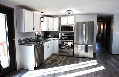 Arnolds Park House | Lake front, HUGE yard and deck, walking distance to the heart of Okoboji
