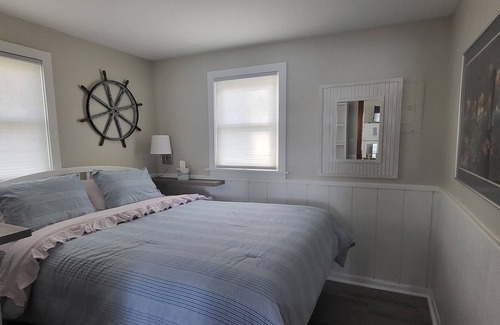 Traverse City Cottage | Lake Leelanau Waterfront Cottage with Mini Harbor - Close to Traverse City!