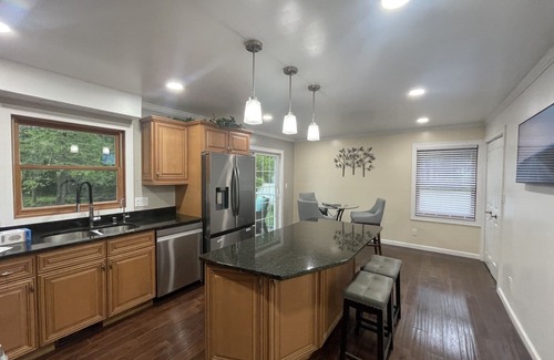 Racine House | Lake Michigan Retreat. Spacious 4-bedroom home on wooded lot across from lake.