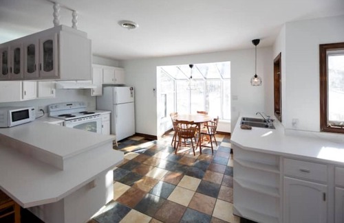 Eastman House | Lake Stuckley country home nestled into Mont Orford