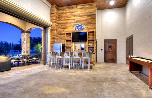 Highland Lake Estates Villa | Lake Travis Waterfront Home w/ views, Pool, Dock, Outdoor Kitchen, Open-Air Bar