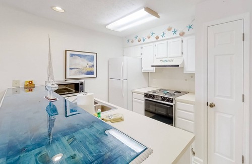 Little River Condo | Lake-view 3rd-floor condo with balcony, hot tub, outdoor pool, washer/dryer, AC