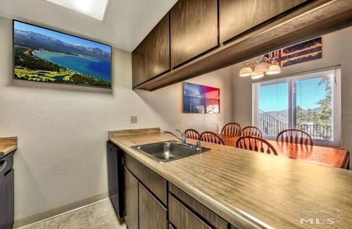 Tahoe Village Condo | Lake View with ski lifts at the parking lot. Upper unit with good views.