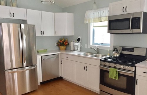 Red Hook Cottage | Lakefront cottage with Year round Hot Tub private beach and dock