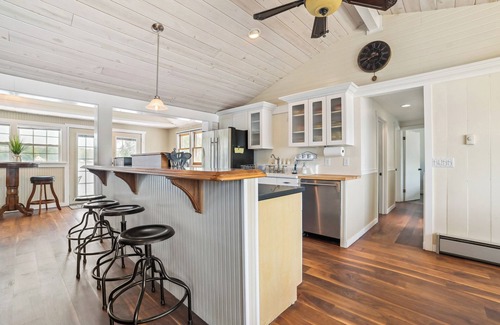 Gladwin Cottage | Lakefront Gladwin Vacation Rental w/Deck & Dock!
