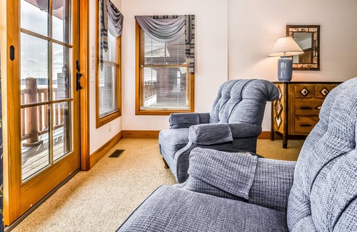 Manitowish Waters Condo | Lakefront home with large deck, gas grill, wood fireplace, heated pool, firepit