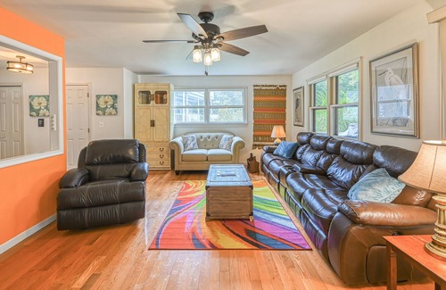 Bumpass House | Lakefront home with spacious deck, dock, game room, hot tub, & sunset views