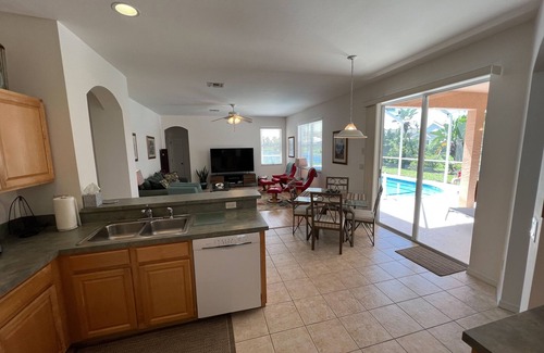 Beachwalk Isles House | Lakefront one-level home with pool, screened lanai & W/D - snowbird-friendly