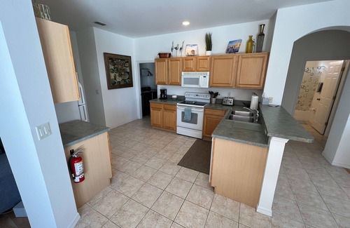 Beachwalk Isles House | Lakefront one-level home with pool, screened lanai & W/D - snowbird-friendly